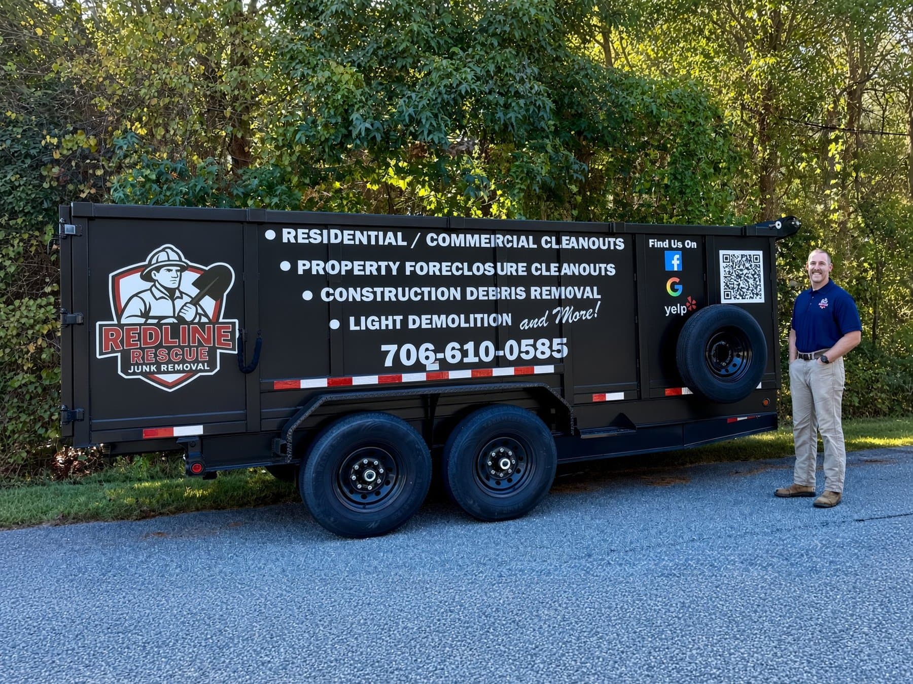Redline Rescue Junk Removal dump trailer parked at a customer's home